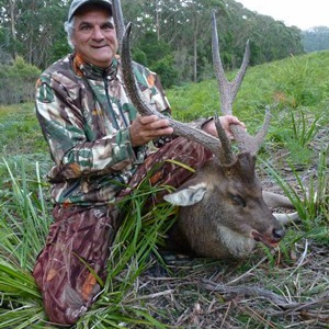 Alex with his rusa, where it fell.